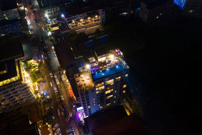 High angle view of illuminated buildings in city at night