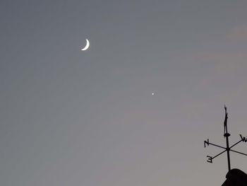 Low angle view of moon against sky at night