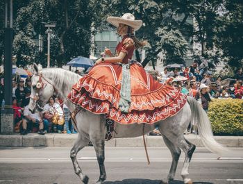 Group of people riding horse