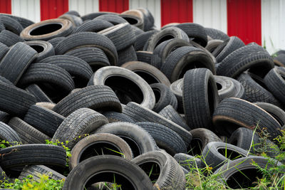 Pile of used tires. old tyres waste for recycle or for landfill. black rubber tire of car. 