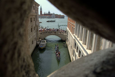 High angle view of footbridge over canal in city