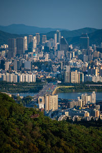 High angle view of city and buildings against sky