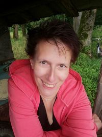 Portrait of smiling girl sitting outdoors