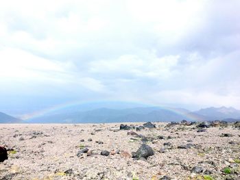 View of mountain range against cloudy sky