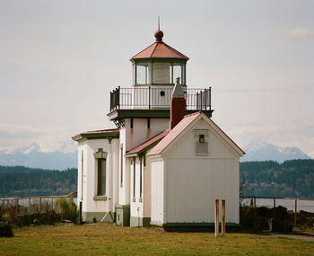 Exterior of house on field against sky