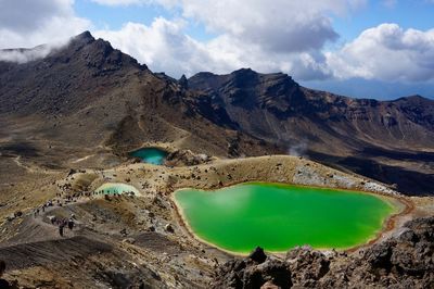 Aerial view of mountain range against sky and volcanic lakes 