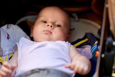 Cute baby lying on bed at home