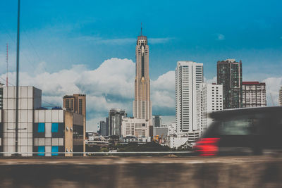 Modern buildings in city against sky