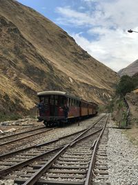 Train on railroad track against sky