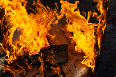 High angle view of fire on wood at night