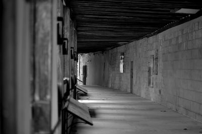 Empty corridor along building