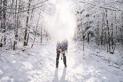 People walking on snow covered field