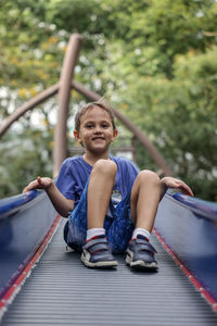 Smiling boy playing at park