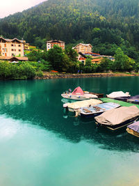 Scenic view of lake against buildings