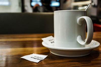 Close-up of coffee cup on table