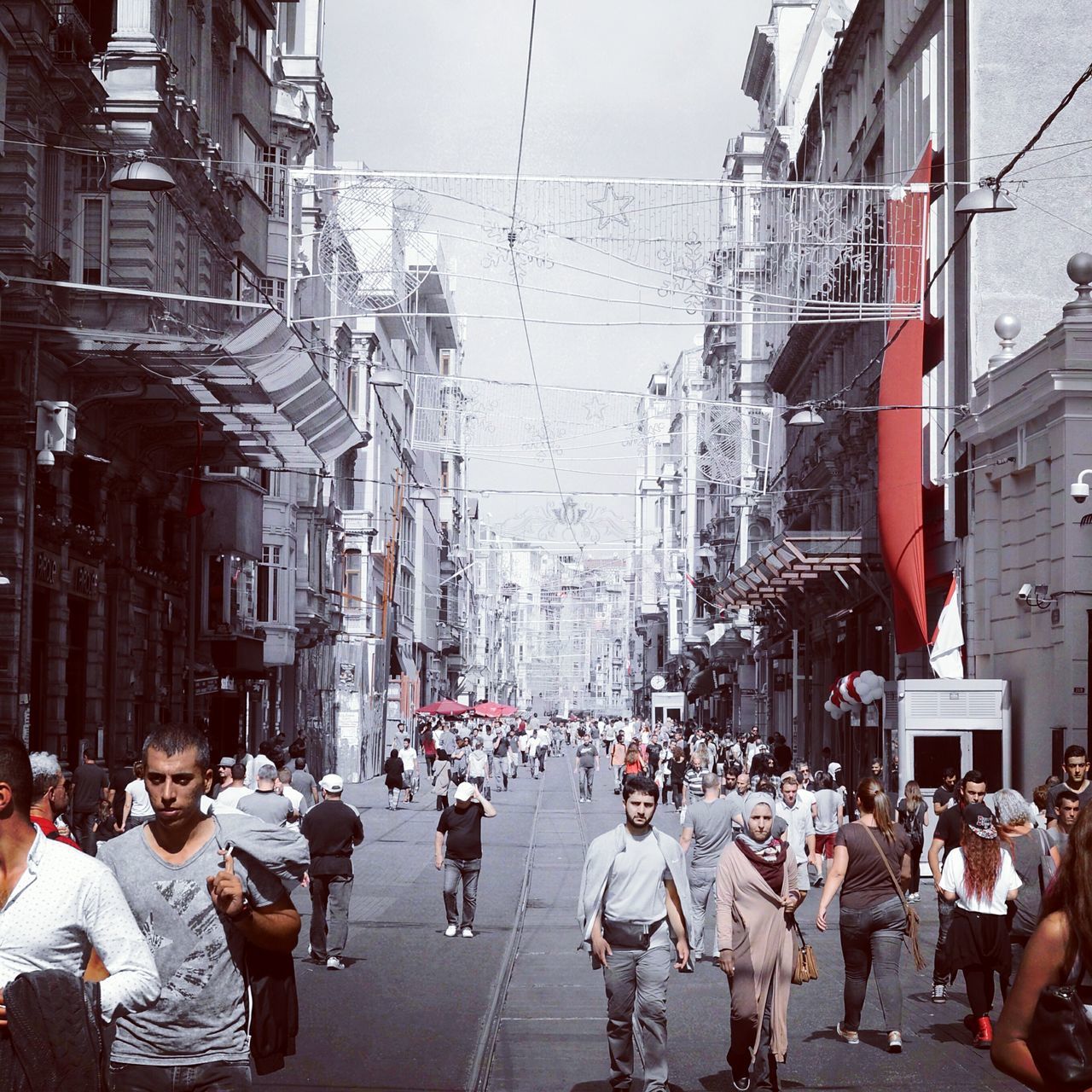 large group of people, building exterior, architecture, built structure, person, men, crowd, lifestyles, city, street, city life, leisure activity, mixed age range, walking, city street, building, day, crowded, outdoors