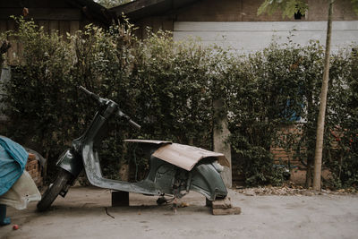 View of abandoned car on field