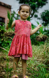 Baby girl playing with mud 