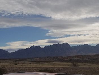 Scenic view of landscape against dramatic sky