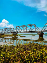 View of bridge over river against sky