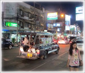 People on city street at night