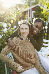 Female friends sitting at table