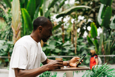 Young man using mobile phone