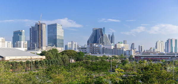 Modern buildings in city against sky