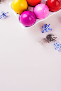 Colorful easter eggs on a pink background. bright easter concept. copy space.