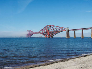 View of bridge over sea against clear sky