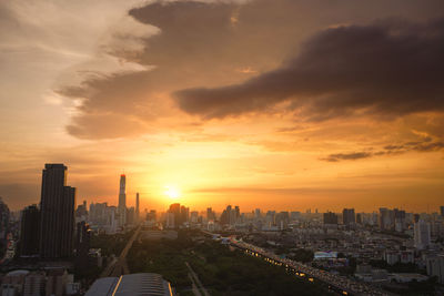 Cityscape against sky during sunset