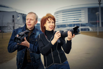 Young couple photographing