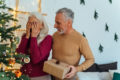 Men in christmas tree