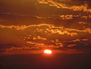 Low angle view of dramatic sky during sunset