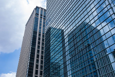 Low angle view of modern buildings against sky