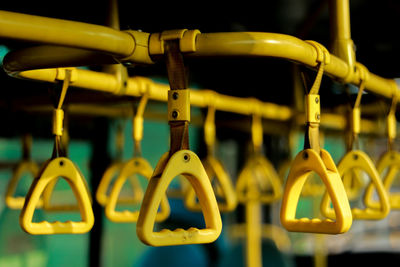 Close-up of handles in bus