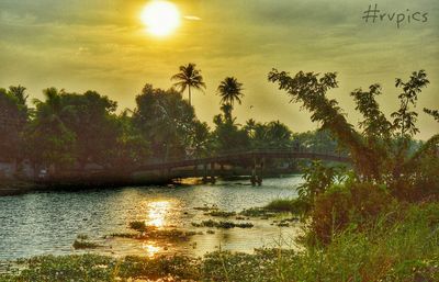 Scenic view of lake at sunset