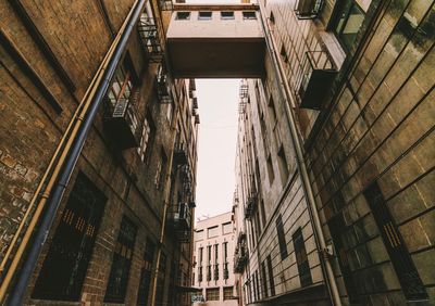 Low angle view of buildings in city against clear sky