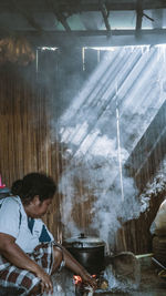 Man working on barbecue grill