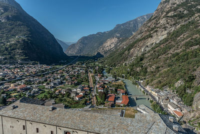 High angle view of townscape and mountains against sky