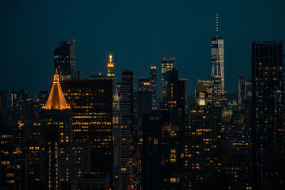 Illuminated buildings in city at night