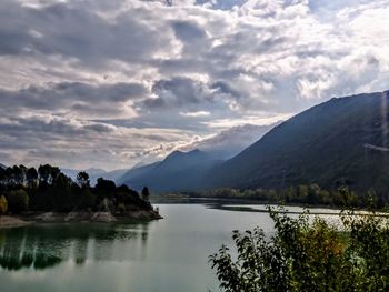 Scenic view of lake and mountains against sky