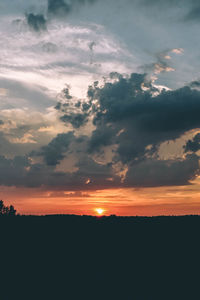 Scenic view of dramatic sky during sunset