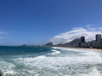 Scenic view of sea against blue sky