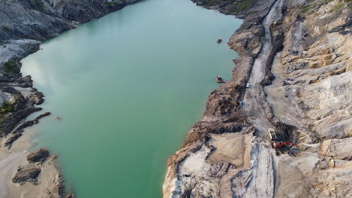 High angle view of rock formations in sea