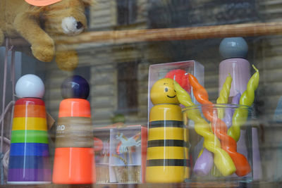 Close-up of toys on glass window