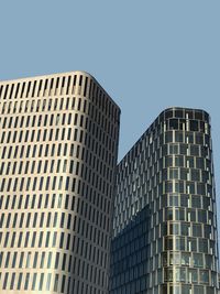 Low angle view of modern building against clear sky