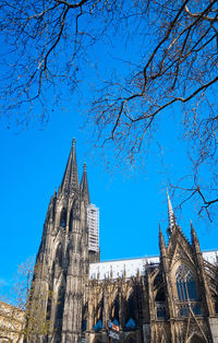 Low angle view of church against blue sky