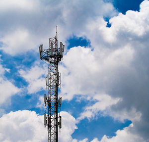 Low angle view of communications tower against sky