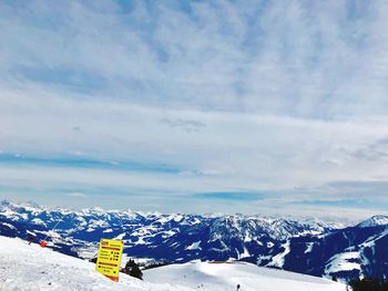 Scenic view of snowcapped mountains against sky